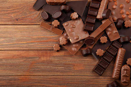 Chocolate of different types on a colored background with a place for textの写真素材