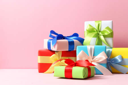 gifts on a colored background top view. Holiday, giving presents, birthday.