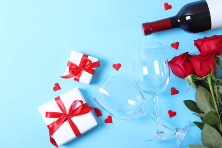 red wine and roses on the table. Valentines day background.の写真素材
