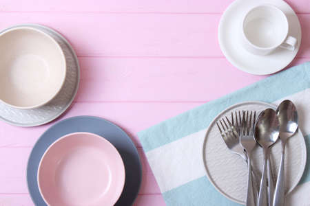 Set of dishes and kitchen utensils top view.