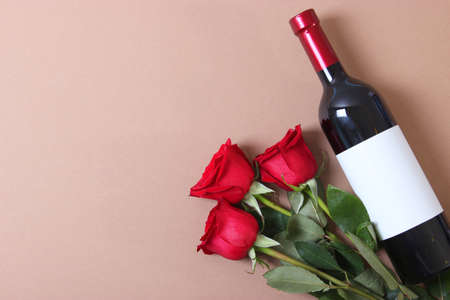 red wine and roses on the table. Valentines day background.の写真素材
