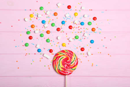 Candies and sweets on a colored background top view with place for text.の写真素材