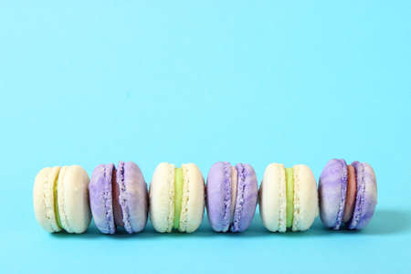 macaroons on a colored background top view.の写真素材
