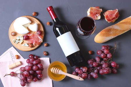 red wine and snacks on the table top view.の写真素材