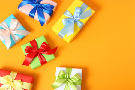 gifts on a colored background top view. Holiday, giving presents, birthday.の写真素材