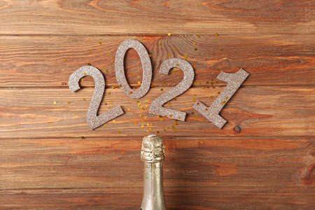 Composition with numbers 2021 and Christmas decor on a colored background