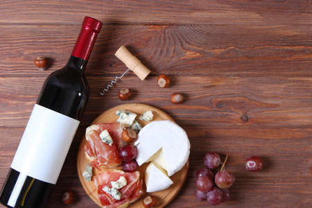 red wine and snacks on the table top view.の写真素材