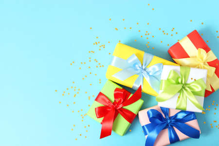 gifts on a colored background top view. Holiday, giving presents, birthday.の写真素材
