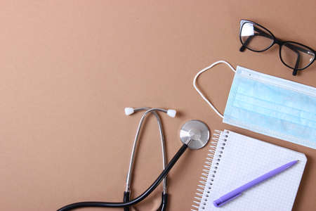 Doctors desk top view. Set of different doctor accessories.