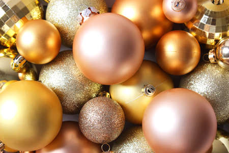 Decorative Christmas balls on a colored background top view.