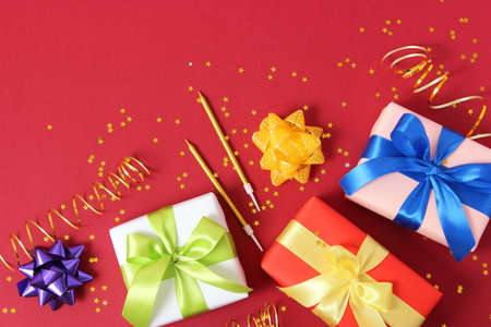 gifts on a colored background top view. Holiday, giving presents, birthday.の写真素材