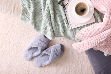 cozy composition with home slippers top view.