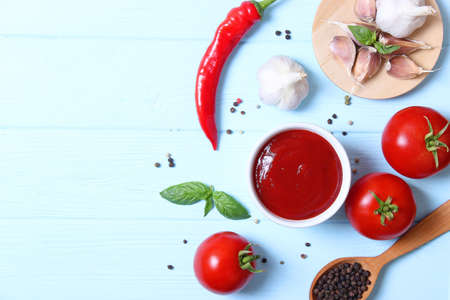 Ketchup on the table. Tomato sauce, fresh tomatoes.の写真素材