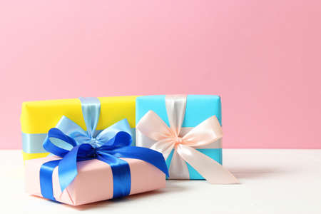 gifts on a colored background top view. Holiday, giving presents, birthday.の写真素材