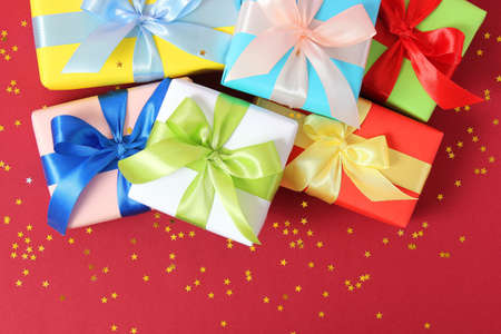 gifts on a colored background top view. Holiday, giving presents, birthday.