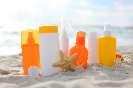 Sunscreens on the beach near the sea close upの写真素材