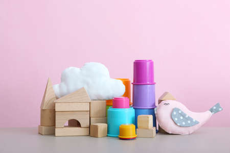 Set of different childrens toys on a colored background. A place to insert textの写真素材
