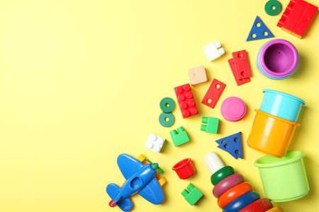 Set of different childrens toys on a colored background top view.の写真素材