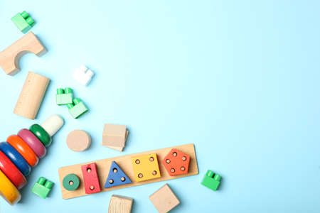 Set of different childrens toys on a colored background top view.の写真素材