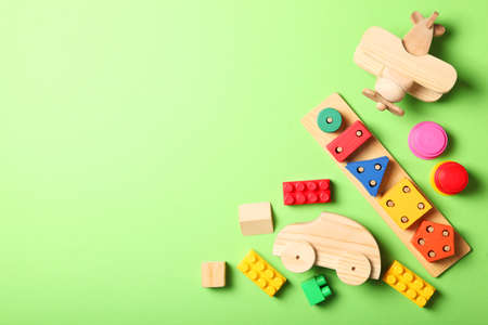 Set of different childrens toys on a colored background top view.の写真素材