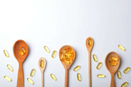 Omega 3 capsules on a white tableの写真素材