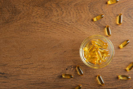 Omega 3 capsules on the table close-up with place for text.の写真素材