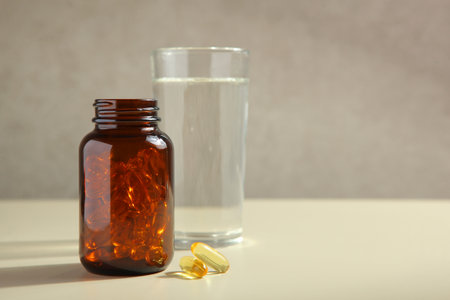 Omega 3 capsules on the table close-up with place for text.の写真素材