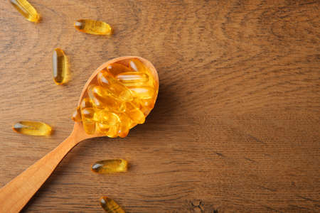 Omega 3 capsules on the table close-up with place for text.の写真素材
