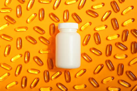Omega 3 capsules on a colored background close-up with place for text.