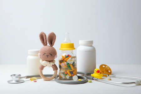 Pediatrics concept. Stethoscope and toy on a light background. High quality photoの写真素材