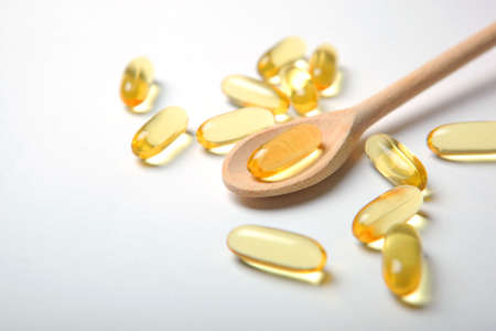 Omega 3 capsules on a white background with place for text.の写真素材