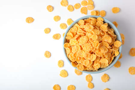 Delicious cornflakes in a plate on a light background.の写真素材
