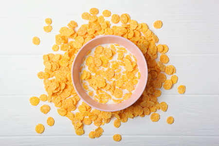 Crispy cornflakes with milk for breakfast on the table close-up.の写真素材