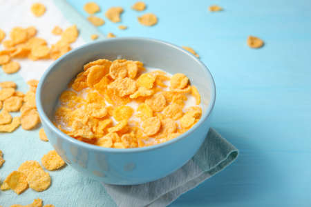 Crispy cornflakes with milk for breakfast on the table close-up.の写真素材