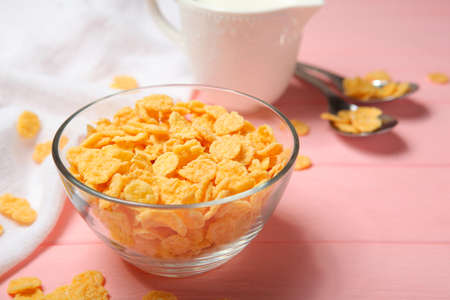 Crispy cornflakes with milk for breakfast on the table close-up.