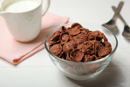 chocolate cornflakes for breakfast on the table close-upの写真素材