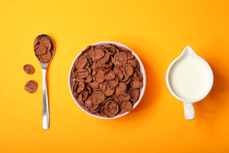 chocolate cornflakes for breakfast on colored background close upの写真素材