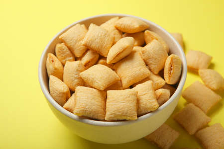 Corn pads with breakfast filling on a colored background close up
