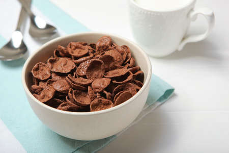 chocolate cornflakes for breakfast on the table close-upの写真素材