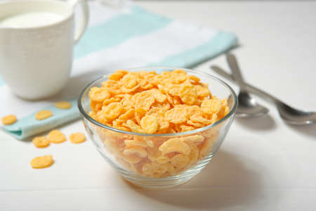 Crispy cornflakes with milk for breakfast on the table close-up.の写真素材