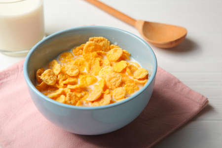 Crispy cornflakes with milk for breakfast on the table close-up.の写真素材