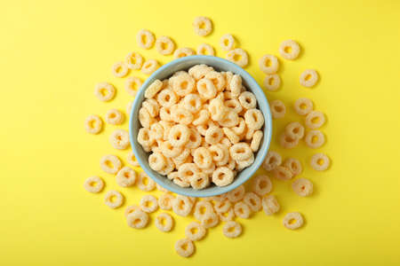Corn rings in glaze for breakfast on a colored background.の写真素材