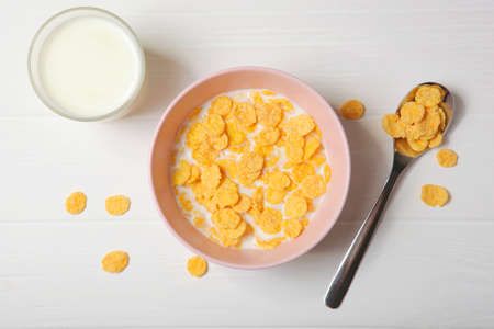 Crispy cornflakes with milk for breakfast on the table close-up.の写真素材