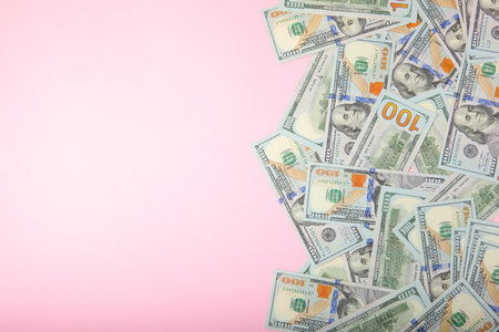 Dollar bills on a colored background close-up top viewの写真素材