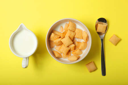 Corn pads with milk for breakfast on the table close-up