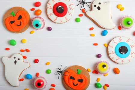 Halloween sweets on colored background close up top view with place for textの写真素材