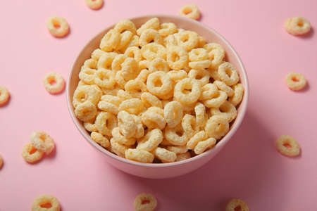 Corn rings in glaze for breakfast on a colored background.の写真素材