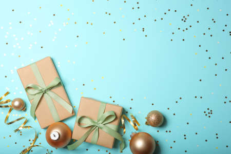 Christmas decorations and gifts on a colored background top viewの写真素材