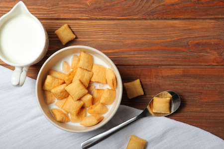 Corn pads with milk for breakfast on the table close-upの写真素材