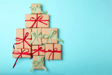 Christmas decorations and gifts on a colored background top viewの写真素材